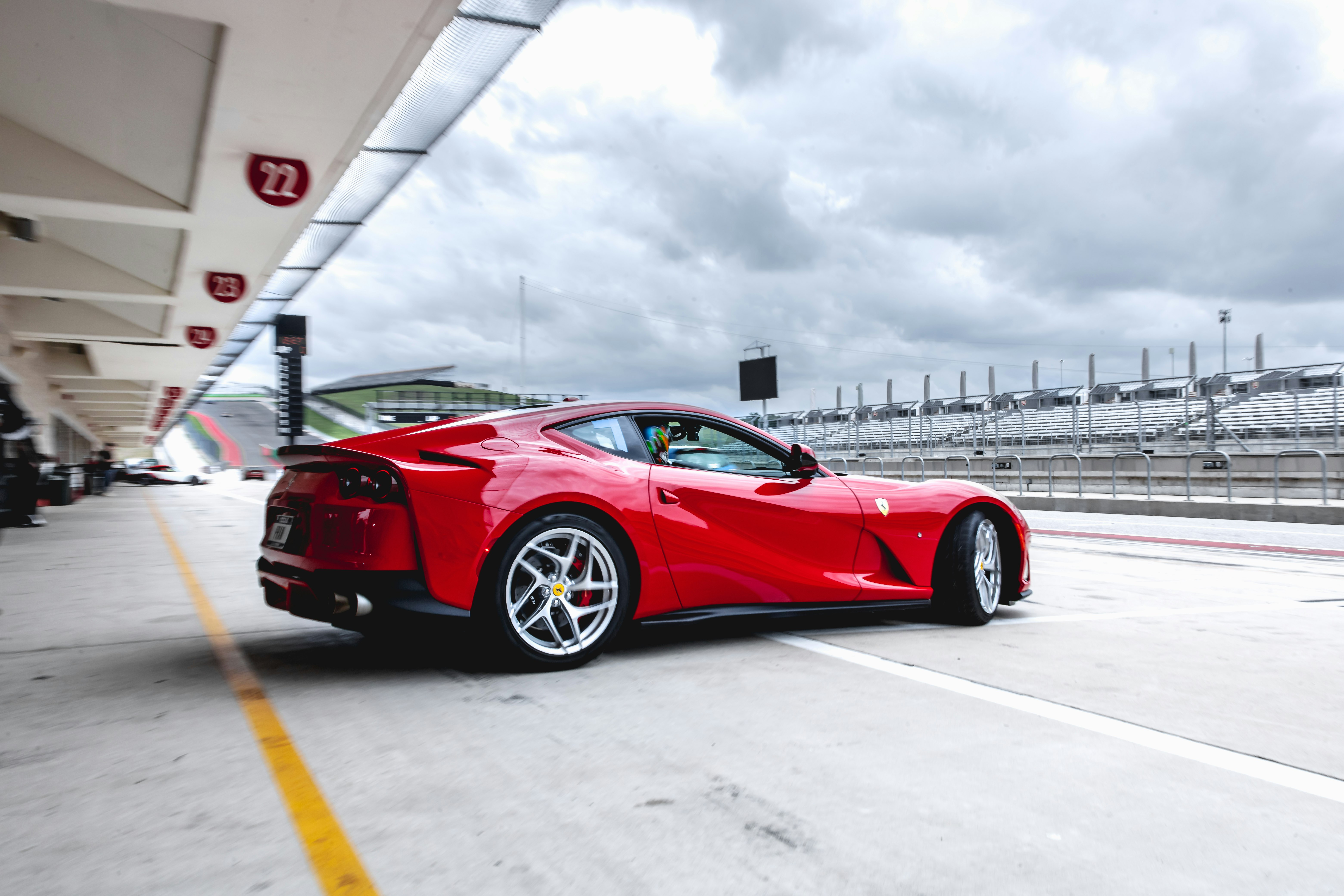 red ferrari 458 italia on road